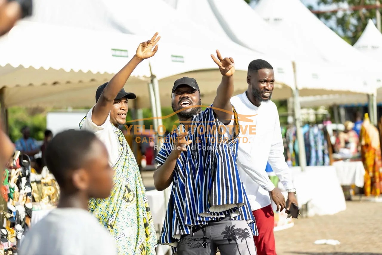 Friends enjoying a lively weekend cultural event in Ghana